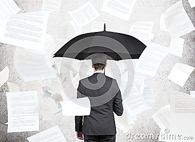 Businessman with umbrella Stock Photo
