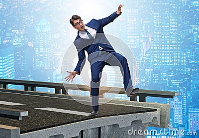 Businessman in uncertainty concept with broken bridge Stock Photo