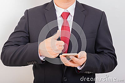 Businessman use smart phone while another hand garentee new smartphone, front view. Business concept Stock Photo