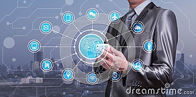 Businessman use smartphone with AI icons together with technology icons, Artificial inteligent conceptual Stock Photo