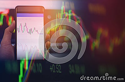 Businessman use smartphone trading forex or Stock exchange market board data screen online mobile in hand Stock Photo