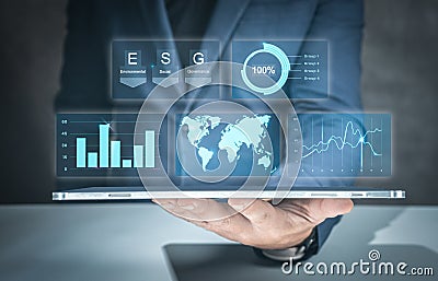 Businessman use tablet for analyze Environmental technology and approaching global sustainable ESG by clean energy and power. Stock Photo