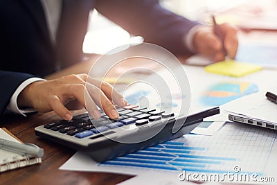 Businessman using calculator to calculate budget, Payments, Business financing and accounting banking concept Stock Photo