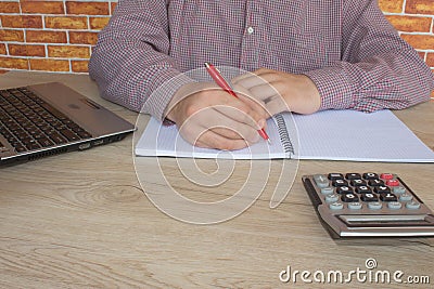 Businessman using a calculator to calculate the numbers. Accounting , Accountancy, Calculation Concept Stock Photo