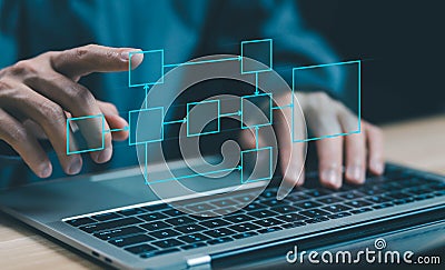 businessman using computer show organigram or diagram algorithm flow to design workflow automation with flowcharts and hierarchy Stock Photo