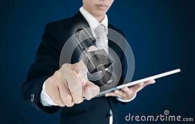 Businessman using digital tablet and pressing unlock icon on screen Stock Photo