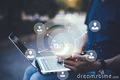 Businessman using a laptop with Analytics and Data Management System on the computer, Hands working on a laptop cloud network grap Stock Photo