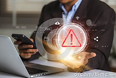 Businessman using laptop with data information privacy and internet connection hacking and spam warning symbol. cyber attack Stock Photo