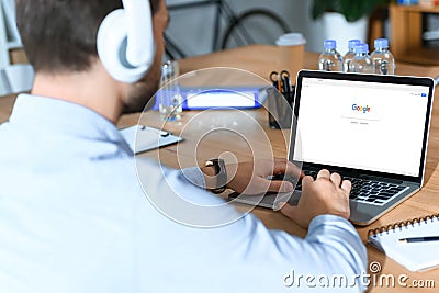 businessman using laptop with loaded Editorial Stock Photo