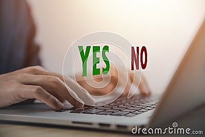 Businessman using laptop showing right and wrong sign have an idea to decide to vote think yes or no Business options for Stock Photo