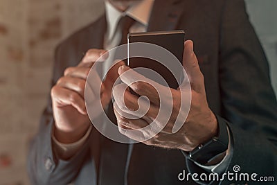 Businessman using mobile phone in fake news infodemic concept Stock Photo