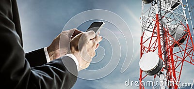 Businessman using mobile phone, with satellite dish telecom network on telecommunication tower on blue sky with sunshine Stock Photo