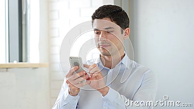 Businessman Using Smartphone for Browsing Stock Photo