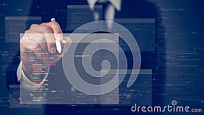 Businessman using a stylus pen to interact with a virtual interface displaying floating computer code and data, emphasizing Stock Photo