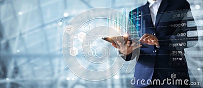 Businessman using tablet analyzing sales data growth graph Stock Photo