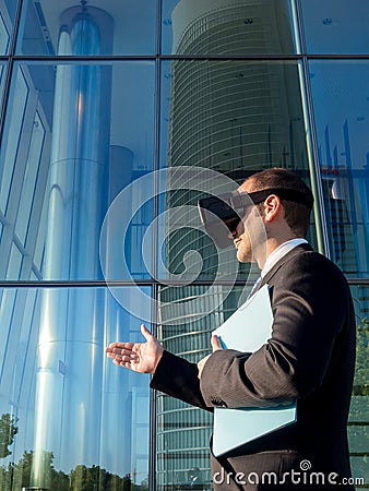 Businessman using virtual reality glasses for a meeting in cyberspace Stock Photo