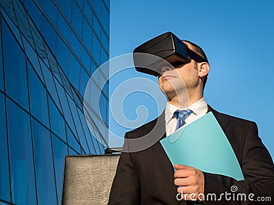 Businessman using virtual reality glasses for a meeting in cyberspace. Stock Photo