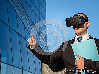 Businessman using virtual reality glasses for a meeting in cyberspace. Stock Photo