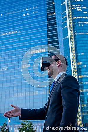 Businessman using virtual reality glasses for a meeting in cyberspace. Stock Photo