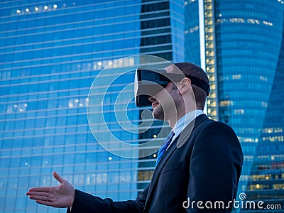 Businessman using virtual reality glasses for a meeting in cyberspace. Stock Photo