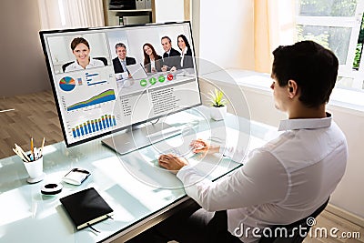 Businessman videoconferencing on computer Stock Photo