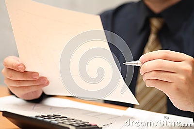 Businessman viewing financial statements Stock Photo