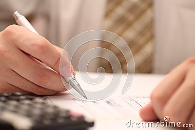 Businessman viewing financial statements Stock Photo