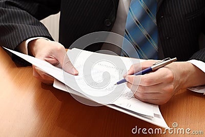 Businessman viewing financial statements Stock Photo