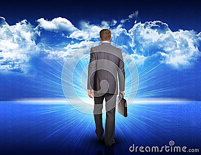 Businessman walking against blue landscape with Stock Photo