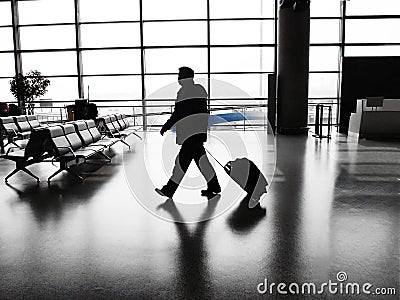 Businessman walking in airport Stock Photo