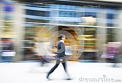 Businessman walking in the city Stock Photo