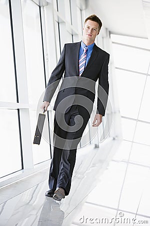 Businessman walking in corridor Stock Photo