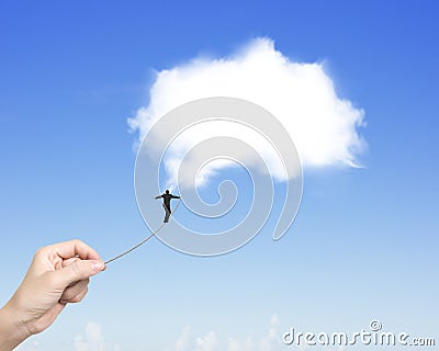 Businessman walking tightrope woman hand pulling toward white cl Stock Photo