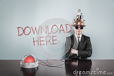 Businessman Wearing Futuristic Helmet By Download Here Text On Wall Stock Photo