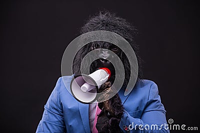 Businessman wearing gorilla mask Stock Photo