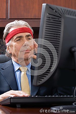 Businessman wearing a sweatband Stock Photo