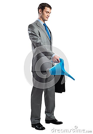 Businessman wears grey suit with suitcase Stock Photo