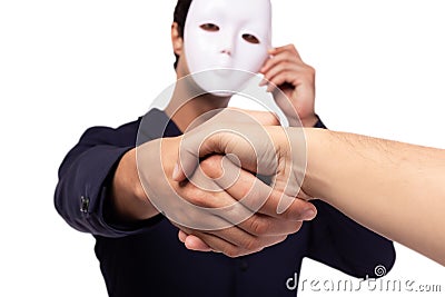 Businessman or white collar worker crime hold white mask. dishonest cheating person betray people for benefit. Hypocrite get Stock Photo