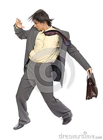 Businessman in the wind Stock Photo