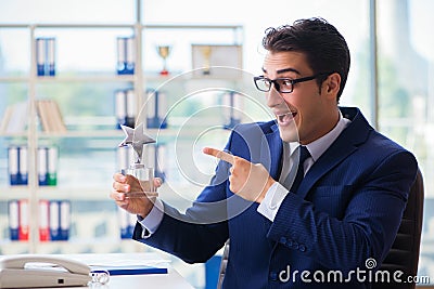 The businessman winning best employee of the month award Stock Photo