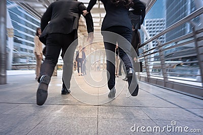 businessman and woman hurry up and running in business city street for rush hour, motion blur background Stock Photo