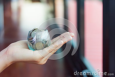 Businessman women holding money jar Stock Photo