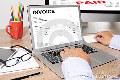 Businessman work Using The Computer Calculating Invoice In Office Invoice Form and Accountant Checking Invoice Stock Photo