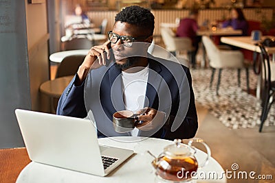 Businessman working from cafe Stock Photo