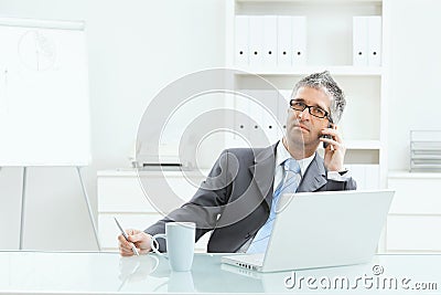 Businessman working at desk Stock Photo