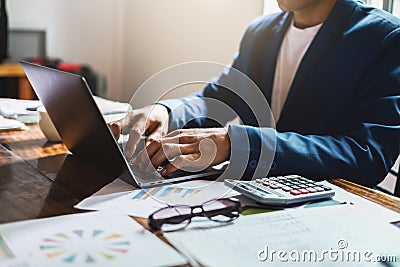 businessman working on desk office with using computer laptop, finance accounting concept Stock Photo