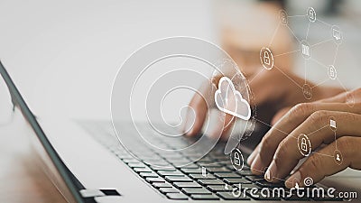 Businessman working on his laptop in the home office selects icon cloud on the virtual display. cloud computing technology, intern Stock Photo