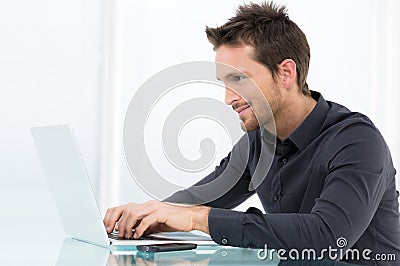 Businessman Working On Laptop Stock Photo