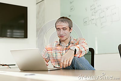 Businessman working laptop sitting office desk Stock Photo