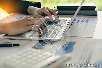 businessman working on laptop He was typing messages to colleagues and documenting financial information Stock Photo